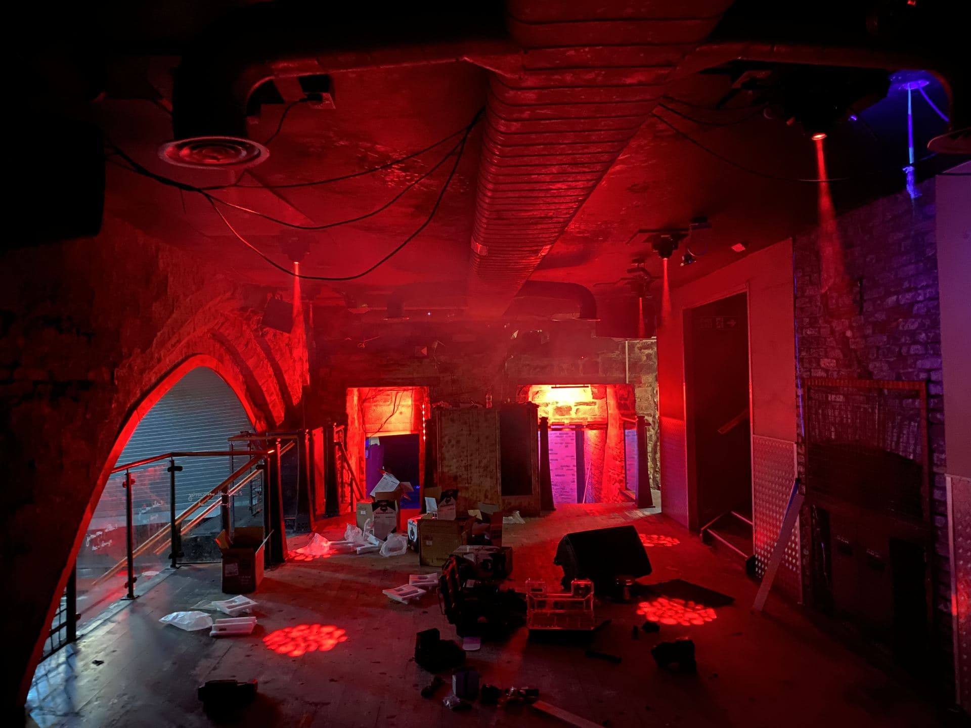 Nightclub corridor lit with red stage lighting