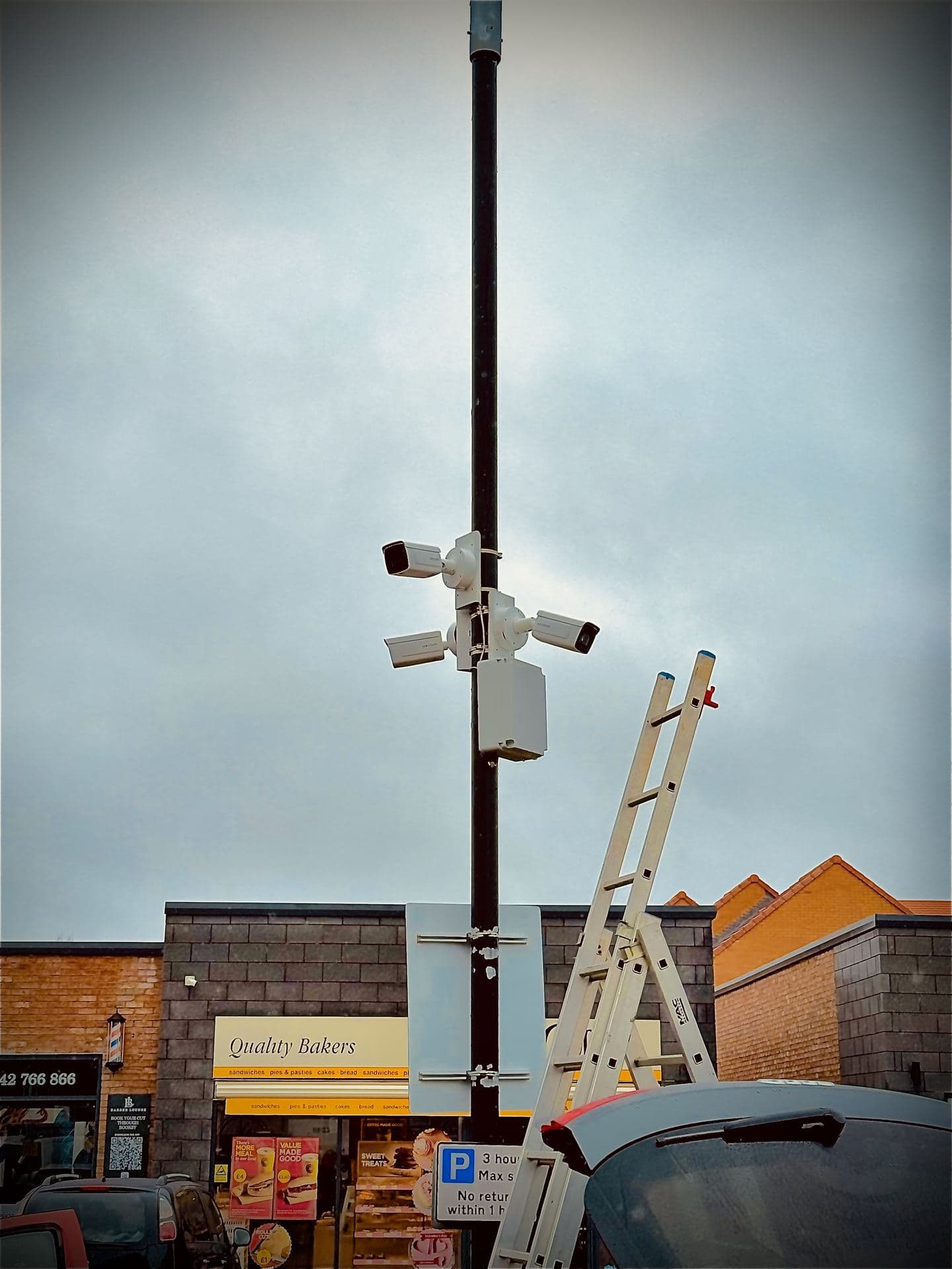 PTZ and bullet CCTV cameras mounted on a high street pole