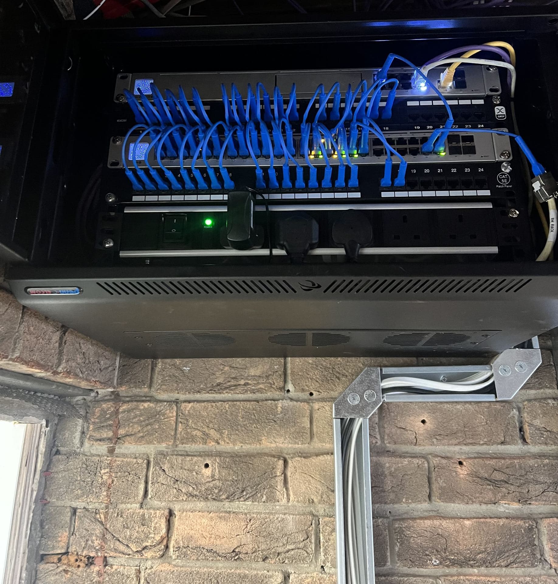 Labelled Cat5e patch panel and network cabinet